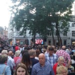 Crows gathers to watch the concert on screens dotted around Maastricht. There were TV's all over the place.