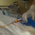 Nurse delivering my daily syringe of chemotherapy. It was either FLAG or IDA. Never did find out which.