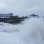 Big ol' waves smashing up the beach front.